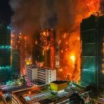 Suman 13 fallecidos en descomunal incendio de 4 edificios en Hong Kong