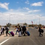 Regularizar a migrantes venezolanos en Chile tendría un impacto fiscal positivo